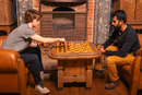 Andrea and Jei playing chess in the Duke's office